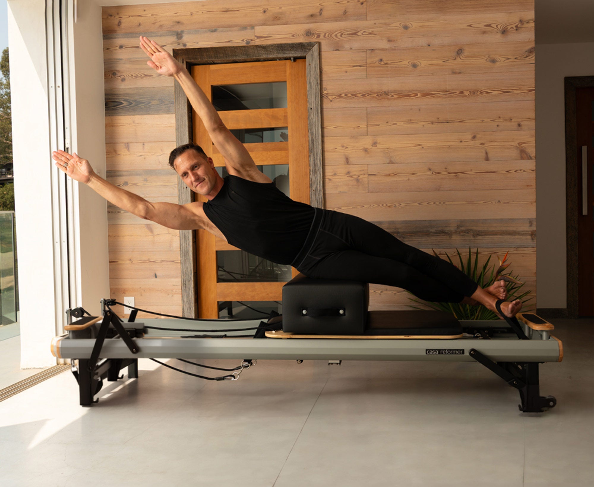 man on a casa reformer from Peak Pilates