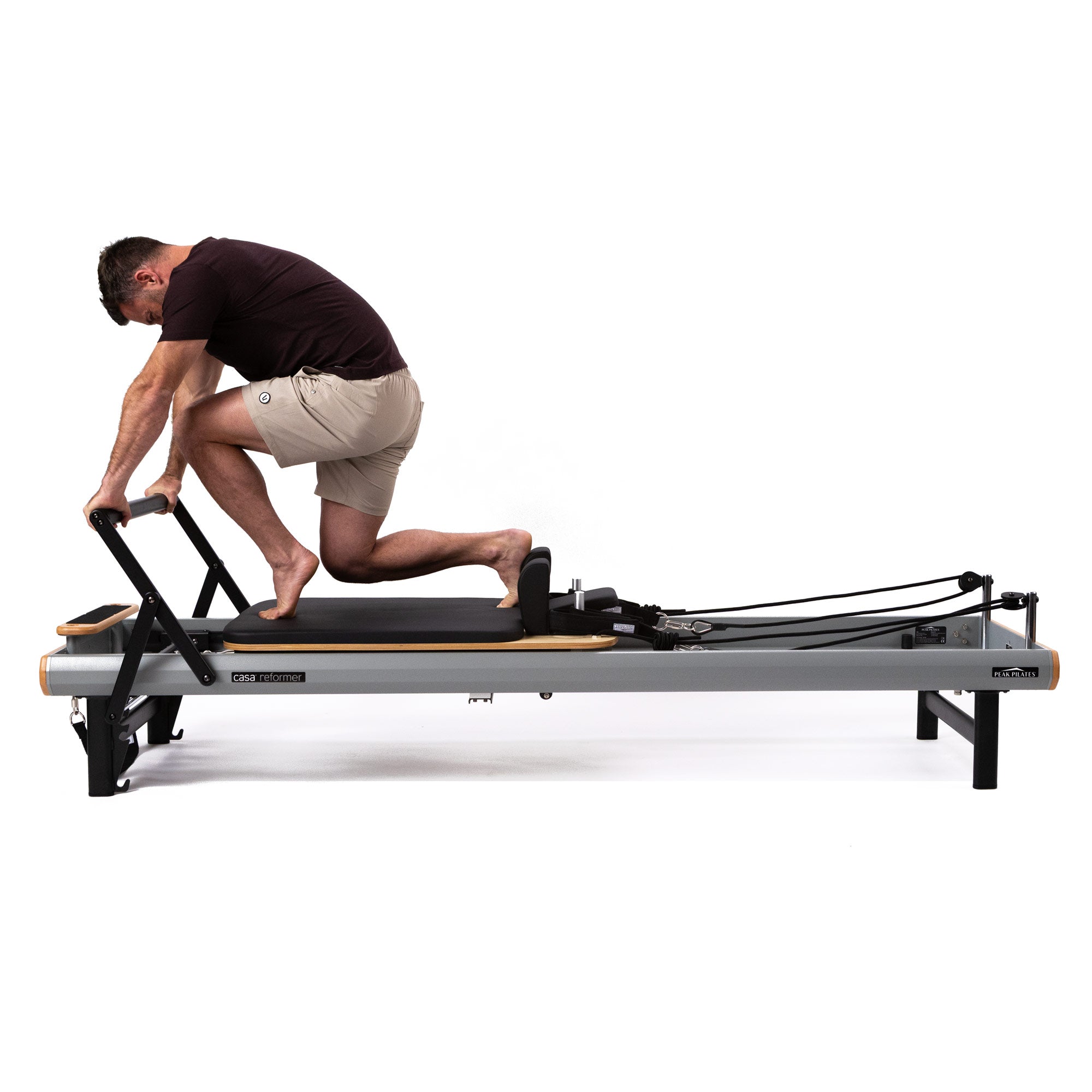 Person using casa reformer by Peak Pilates